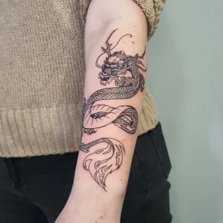 - Dragon Tattoo  - Black Hat Tattoo Dublin - on arm - The Black Hat Tattoo