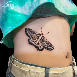 side on women butterfly tattoo  - Black Hat Tattoo Dublin - The Black Hat Tattoo