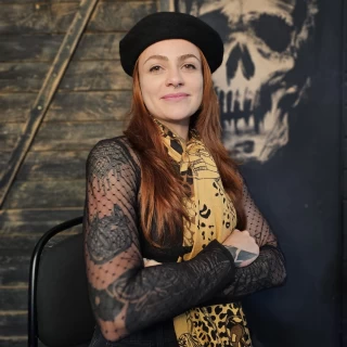 Stella - The Black Hat Tattoo