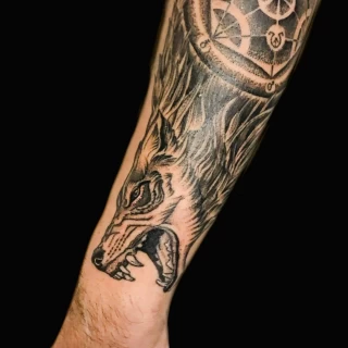 on arm and forest - Wolf Tattoo - Black Hat Tattoo Dublin - The Black Hat Tattoo