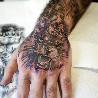 Realistic lion on hand - Lion Tattoo - Black Hat Tattoo Dublin - The Black Hat Tattoo