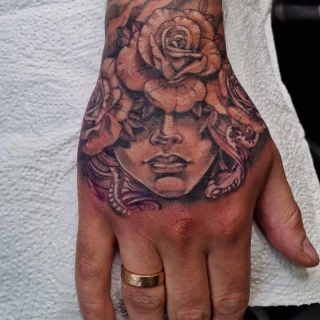 Realism Medusa on hand - Hands & Fingers Tattoo - Black Hat Tattoo Dublin - The Black Hat Tattoo