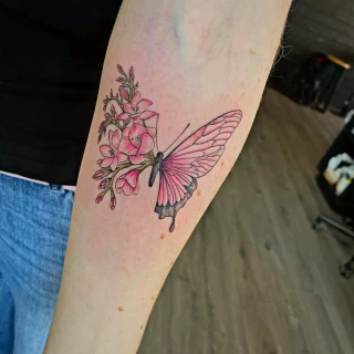 Half flowers and half butterfly tattoo  - Black Hat Tattoo Dublin - The Black Hat Tattoo