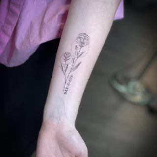 Flowers and roman numera on arm - Minimalism Dotwork and Linework  - Black Hat Tattoo Dublin - The Black Hat Tattoo