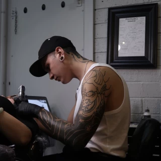 AJ - The Black Hat Tattoo