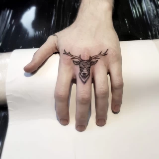 Deer Tattoo - Black Hat Tattoo Dublin - stag on finger - The Black Hat Tattoo