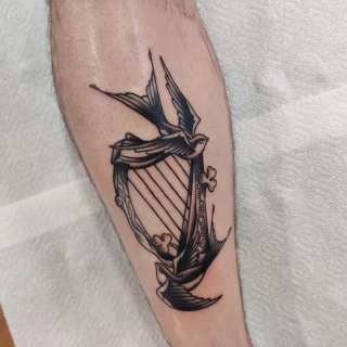 Swallow birds and harp - Bird Tattoo - Black Hat Tattoo Dublin - The Black Hat Tattoo