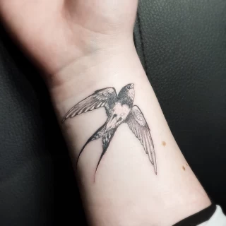 Swallow tattoo on wrist - Bird Tattoo - Black Hat Tattoo Dublin - The Black Hat Tattoo