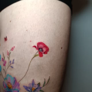 Piroska - guest artist - poppy tattoo - colorwork - floral tattoo - the black hat tattoo Dublin- 2025 - The Black Hat Tattoo