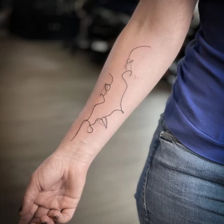 Single ligne faces on arm - Small Tattoo idea - Black Hat Tattoo Dublin - The Black Hat Tattoo