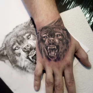 Realism Tattoo Wolf on hand - Wolf Tattoo - Black Hat Tattoo Dublin - The Black Hat Tattoo