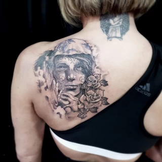 Woman face on shoulder - Realism, Microrealism and Portrait Tattoo - Black Hat Tattoo Dublin - The Black Hat Tattoo