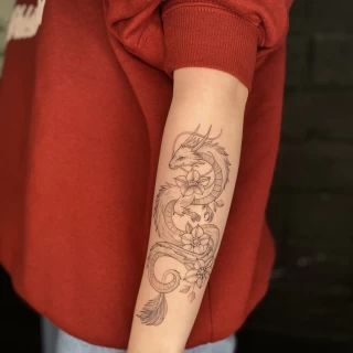 Dragon Tattoo on lower arm - Black Hat Tattoo Dublin - The Black Hat Tattoo