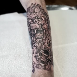Lion and skull tattoo - Tattoo for men - Black Hat Tattoo Dublin - The Black Hat Tattoo