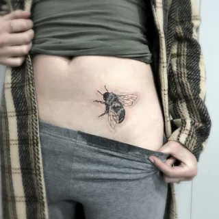 Bee Tattoo on hips - Black Hat Tattoo Dublin - The Black Hat Tattoo