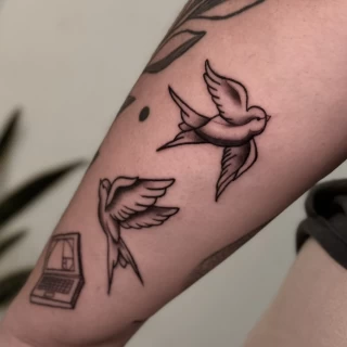 Stella - resident artist - swallow tattoo - old school - black and grey - the black hat tattoo Dublin- 2025 - The Black Hat Tattoo
