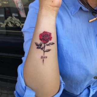 smal realism red rose on arm - Rose Tattoo - Black Hat Tattoo Dublin - The Black Hat Tattoo