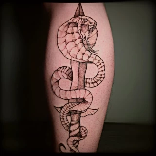 Snake and sword tattoo - Snake Tattoo - Black Hat Tattoo Dublin - The Black Hat Tattoo