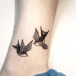 Swallow Tattoo twins - Bird Tattoo - Black Hat Tattoo Dublin - The Black Hat Tattoo