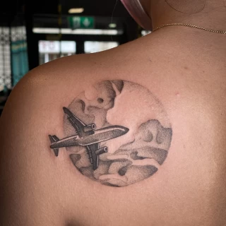 Dotwork and plane tattoo on shoulder - Minimalism Dotwork and Linework  - Black Hat Tattoo Dublin - The Black Hat Tattoo