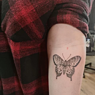 Butterfly Tattoo on upper arm - Black Hat Tattoo Dublin - The Black Hat Tattoo